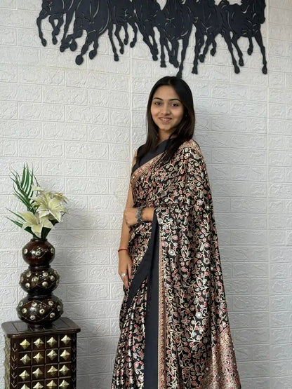 Close-up of real mirror work on black mal cotton saree
