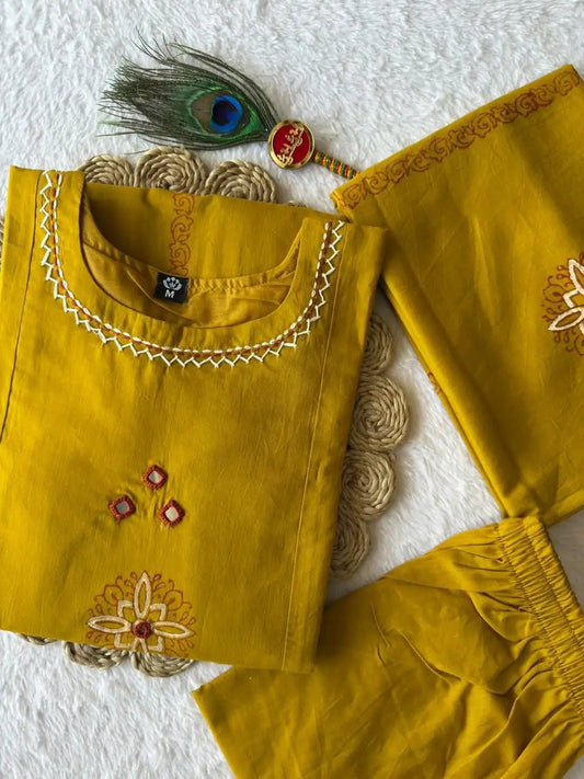 Mustard pure cotton kurti set featuring hand mirror work and mul cotton block print dupatta
