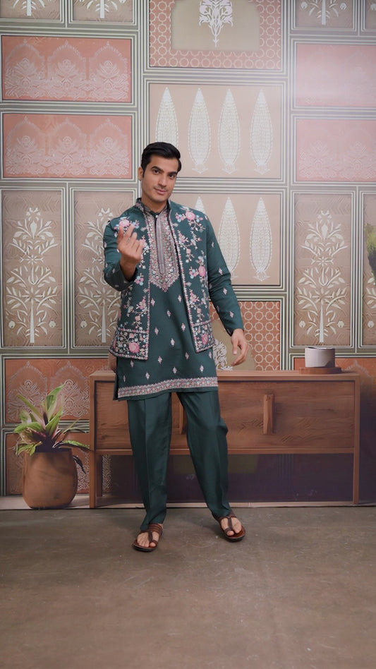 Man wearing a yellow embroidered sherwani in a decorated room.